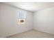 Well-lit bedroom featuring neutral carpeting and paint and a window with blinds at 25606 N 154Th Ln, Surprise, AZ 85387