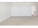 Bedroom featuring neutral carpet, and an entry doorway to the bathroom at 25606 N 154Th Ln, Surprise, AZ 85387