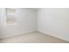 Light-filled bedroom with neutral carpet, white walls, and a window to let in light at 25606 N 154Th Ln, Surprise, AZ 85387