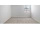 Bright bedroom with neutral carpet, white walls, and a window to let in light at 25606 N 154Th Ln, Surprise, AZ 85387