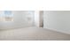 Cozy bedroom with plush carpet, two windows, and a neutral color palette at 25606 N 154Th Ln, Surprise, AZ 85387