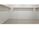 Spacious walk-in closet with shelving ready for ample storage at 25606 N 154Th Ln, Surprise, AZ 85387