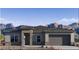Charming single-story home featuring desert landscaping and a stone-accented entryway with mountain views at 25606 N 154Th Ln, Surprise, AZ 85387