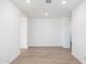 Bright hallway features wood-look floors connecting various living spaces at 25606 N 154Th Ln, Surprise, AZ 85387