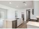 Bright kitchen features an island, stainless steel appliances, and ample natural light at 25606 N 154Th Ln, Surprise, AZ 85387