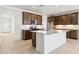 Open kitchen featuring an island, stainless steel appliances, and modern cabinets at 25606 N 154Th Ln, Surprise, AZ 85387
