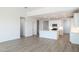 Open concept kitchen with a large island, modern appliances, and white cabinetry at 25606 N 154Th Ln, Surprise, AZ 85387