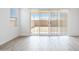 Bright living room with tile floors and large sliding glass door to the backyard at 25606 N 154Th Ln, Surprise, AZ 85387