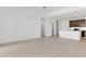 Spacious, open floor plan featuring tile floors and leading to a kitchen with an island at 25606 N 154Th Ln, Surprise, AZ 85387