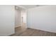 Spacious living room with wood-look floors and lots of natural light at 25606 N 154Th Ln, Surprise, AZ 85387