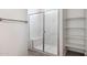 Modern bathroom with a glass-enclosed shower with marble accents and convenient built-in shelving at 25606 N 154Th Ln, Surprise, AZ 85387