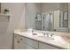 Clean bathroom featuring white vanity and a large mirror for natural light at 30227 N 124Th Dr, Peoria, AZ 85383