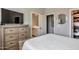 Bedroom featuring ensuite bathroom and walk-in closet with ample storage at 30227 N 124Th Dr, Peoria, AZ 85383
