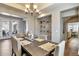 Charming dining room with stylish decor, a large wooden table, and ample seating for gatherings at 30227 N 124Th Dr, Peoria, AZ 85383