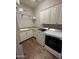 Well-equipped laundry room with granite countertops, sink, cabinets, washer and dryer at 30227 N 124Th Dr, Peoria, AZ 85383