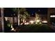 Beautifully lit backyard showcasing lush greenery and a serene outdoor ambiance at 32795 N Hidden Canyon Dr, San Tan Valley, AZ 85144