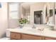 Well-maintained bathroom featuring a vanity with a sink, a mirror, and ample lighting for comfortable use at 32795 N Hidden Canyon Dr, San Tan Valley, AZ 85144