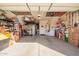 Spacious garage with overhead storage racks, toolboxes, work bench, and plenty of storage at 32795 N Hidden Canyon Dr, San Tan Valley, AZ 85144