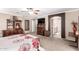 Comfortable main bedroom boasts an en-suite bathroom, neutral color scheme, and ample space for relaxation and rest at 32795 N Hidden Canyon Dr, San Tan Valley, AZ 85144