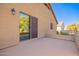 Wide patio with neutral tones and sliding door access to yard, perfect for entertaining or enjoying quiet moments outdoors at 32795 N Hidden Canyon Dr, San Tan Valley, AZ 85144