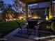 Inviting covered patio with comfortable seating and a cozy fire pit, perfect for outdoor relaxation at 32795 N Hidden Canyon Dr, San Tan Valley, AZ 85144