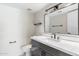Modern bathroom featuring a large mirror, sleek vanity with ample storage, and a toilet with a clean design at 4220 E Everett Dr, Phoenix, AZ 85032