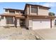 Two-story home with attached garage, solar panels, and well-maintained landscaping at 4220 E Everett Dr, Phoenix, AZ 85032