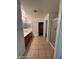 Bathroom view with tiled floors, glass shower, large closet, and double sink vanity at 4943 W Lynne Ln, Laveen, AZ 85339