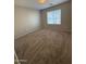 Neutral carpeted bedroom with one window and blank walls at 4943 W Lynne Ln, Laveen, AZ 85339