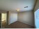 Bedroom with carpet, window, and closet, offering a cozy and functional space at 4943 W Lynne Ln, Laveen, AZ 85339