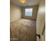 Bedroom with neutral carpet, one window, and blank walls at 4943 W Lynne Ln, Laveen, AZ 85339