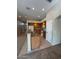 Open kitchen with oak cabinets, tile flooring, a breakfast bar, and white appliances at 4943 W Lynne Ln, Laveen, AZ 85339