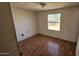 Cozy bedroom with wood floors and a window offering natural light at 508 S 98Th St, Mesa, AZ 85208