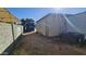 Exterior alleyway with a view of the home, a dumpster, and an air conditioning unit at 508 S 98Th St, Mesa, AZ 85208