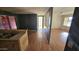 Interior shot of a living room and kitchen area featuring dated features and showing wear and tear at 508 S 98Th St, Mesa, AZ 85208