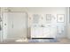 Well-lit bathroom featuring a glass shower, double vanity, and decorative wall art at 520 E Aurora Dr, San Tan Valley, AZ 85140