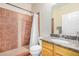 Full bathroom featuring tile walk-in shower, commode and sink with granite countertop at 525 N Miller Rd # 113, Scottsdale, AZ 85257