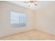 Bedroom with neutral walls, ceiling fan, tile flooring and a window with blinds at 525 N Miller Rd # 113, Scottsdale, AZ 85257