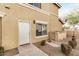 Beige home exterior featuring a well-maintained front yard with desert landscaping at 525 N Miller Rd # 113, Scottsdale, AZ 85257