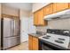 Bright kitchen features stainless steel appliances and granite countertops at 525 N Miller Rd # 113, Scottsdale, AZ 85257