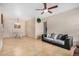 Open-concept living room with tile flooring and view of the dining area at 525 N Miller Rd # 113, Scottsdale, AZ 85257