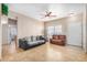 Spacious living room with tile floors, ceiling fan, and neutral-colored walls at 525 N Miller Rd # 113, Scottsdale, AZ 85257