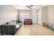 Open living room with tile floors, ceiling fan, and natural light from the front window at 525 N Miller Rd # 113, Scottsdale, AZ 85257