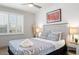 Bright bedroom features a comfortable bed, stylish bedding, and ample natural light from window at 6845 E Lewis Ave, Scottsdale, AZ 85257