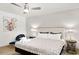Cozy bedroom with a comfortable queen bed, stylish decor, and modern ceiling fan at 6845 E Lewis Ave, Scottsdale, AZ 85257