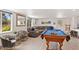 Relaxing and functional game room featuring a pool table, stylish seating, and plenty of light at 6845 E Lewis Ave, Scottsdale, AZ 85257