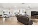 Bright and spacious living room features hard surface floors, modern decor and plenty of natural light at 6845 E Lewis Ave, Scottsdale, AZ 85257