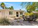 Inviting outdoor patio featuring stone pavers, dining set, and lush landscaping, perfect for entertaining guests at 6845 E Lewis Ave, Scottsdale, AZ 85257