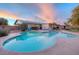 Beautiful pool with integrated spa, surrounded by well-manicured landscaping and comfortable seating areas at 6845 E Lewis Ave, Scottsdale, AZ 85257