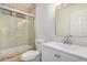 Clean and functional bathroom with tiled shower, and updated vanity at 8201 W Tuckey Ln, Glendale, AZ 85303